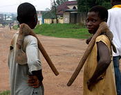 boys wait to help dig bus out of mud  Kumasi