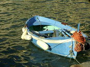 Blue boat waiting for calm