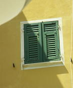 Green shuttered window